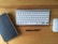 A close-up of a sleek desk with a laptop and office supplies neatly arranged.