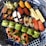 A close-up of a beautifully arranged sushi platter with various types of sushi.