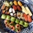 A close-up of a beautifully arranged sushi platter with various types of sushi.