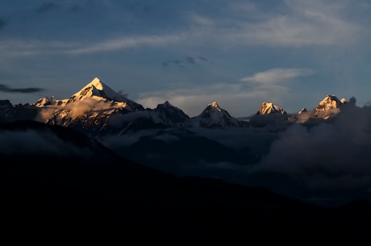 mountain ranges under cloudy sky in Munsyari India