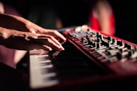 selective focus photo of person playing electric guitar