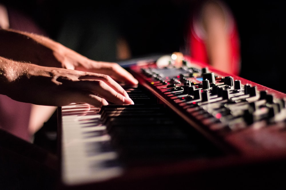 selective focus photo of person playing electric guitar