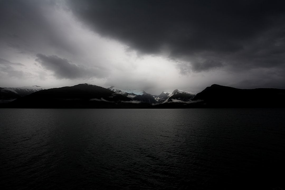 body of water during cloudy daytime