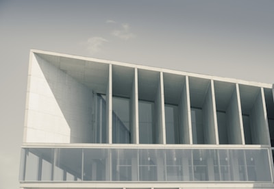 A modern architectural building with large glass windows and clean lines.