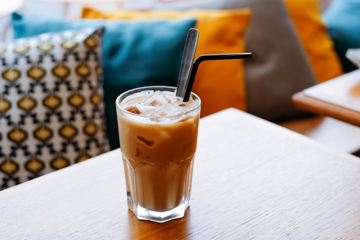 caramel iced coffee on table