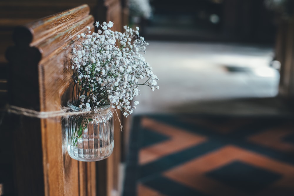 white petaled flower on glass vase