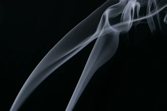 Dark swirling smoke with subtle light highlights moving across the screen.