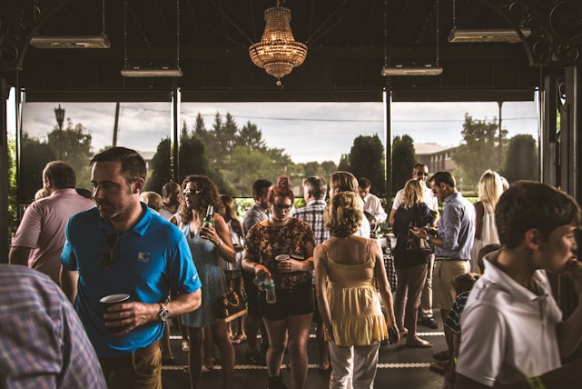A diverse group of professionals engaging in a lively discussion at a networking event.