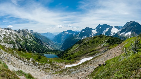 mountain near body of water during daytime in North Cascades National Park United States