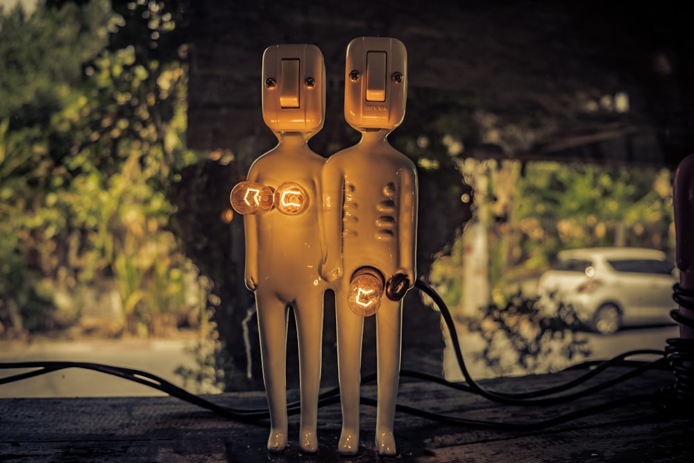 Funny sculpture of a male/female pair with electrical body parts