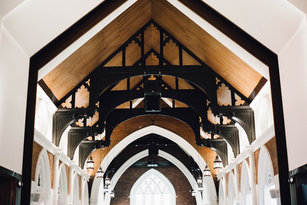a large church with a very tall wooden ceiling