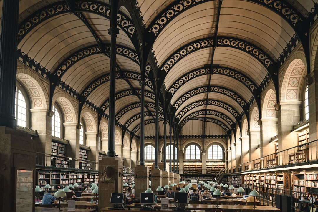 gray concrete building interior, Parisian library