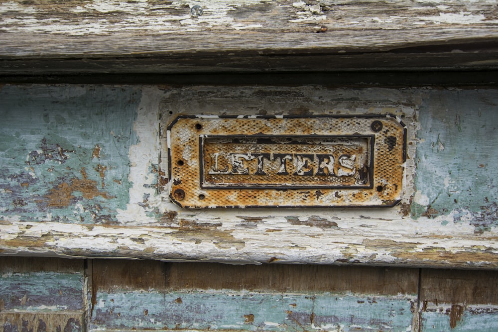 letters signage inside wooden panel