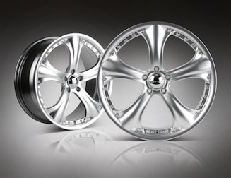 A selection of stylish alloy wheels displayed on a clean surface.