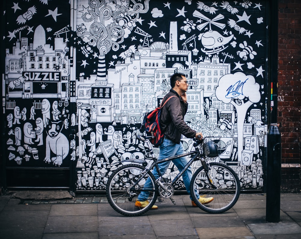 man walking in street while wearing red backpack