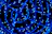 Close-up of a glowing neural network pattern in deep electric blue and neon teal hues.