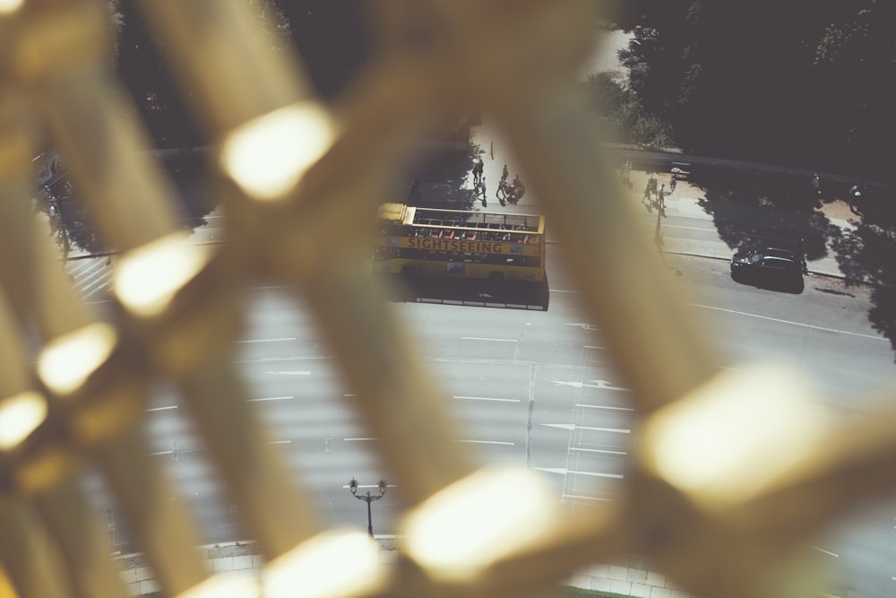 a yellow school bus driving down a street