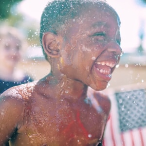 topless boy smiling