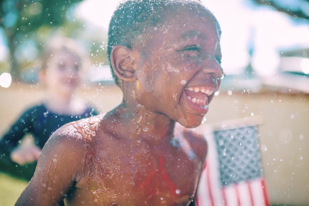 topless boy smiling