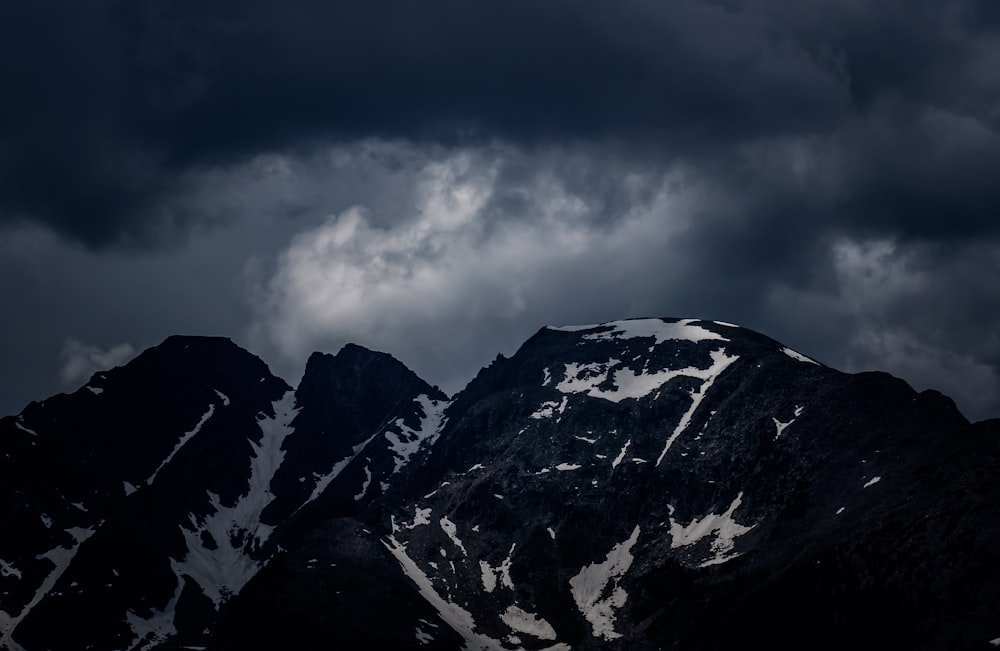 mountain alps under stratocumulus clouds