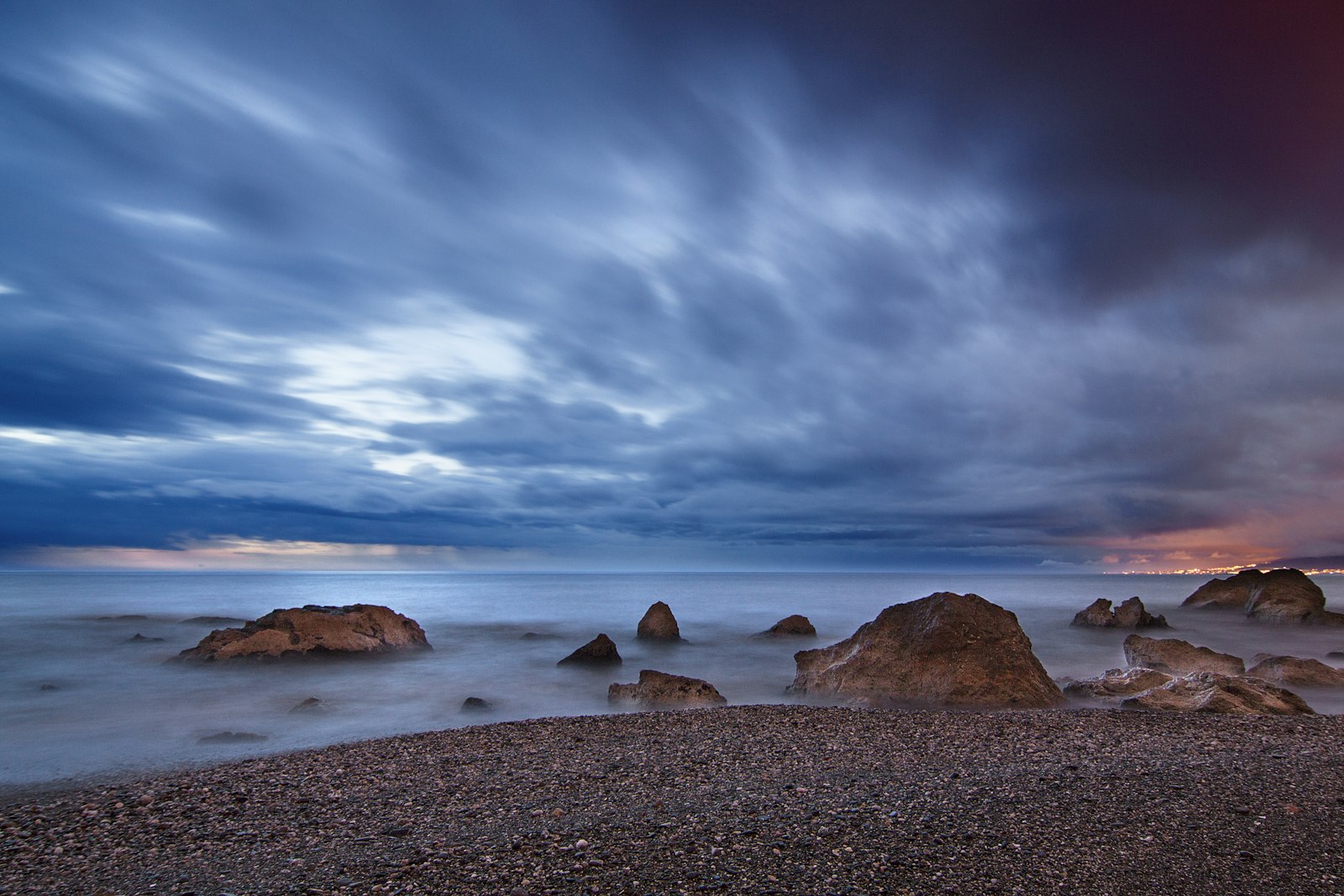 Tokina AT-X Pro 12-24mm F4 (IF) DX sample photo. Rocks at seashore under photography