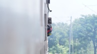 Sony headphones being used by a traveler on a train.