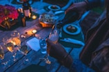 person putting wine on flute glass