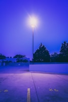 Freshly painted parking lot lines under a bright morning sky.