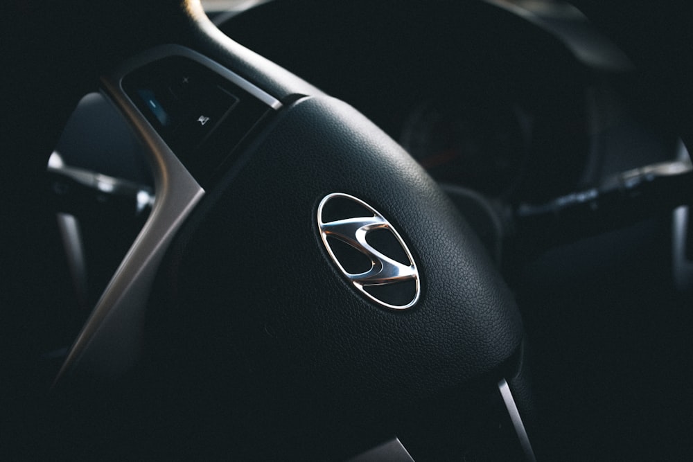 selective focus of black Hyundai steering wheel