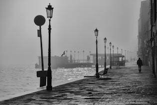 silhouette person walking at walkway