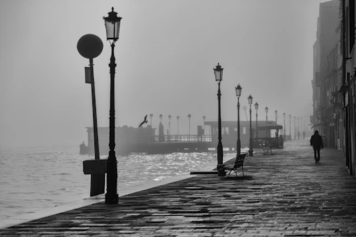 silhouette person walking at walkway