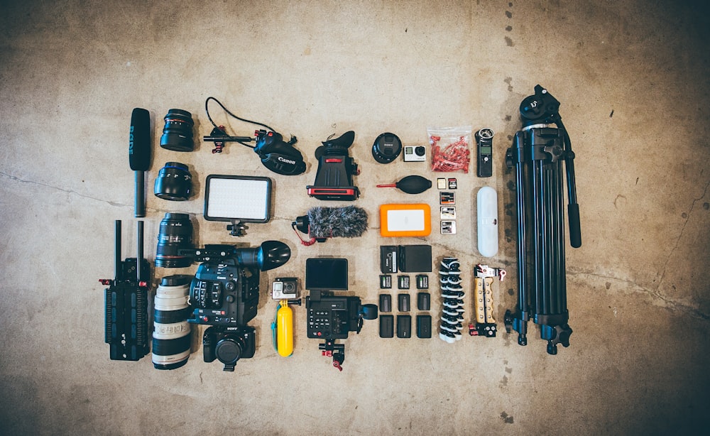 flat lay photo of camera gear on floor