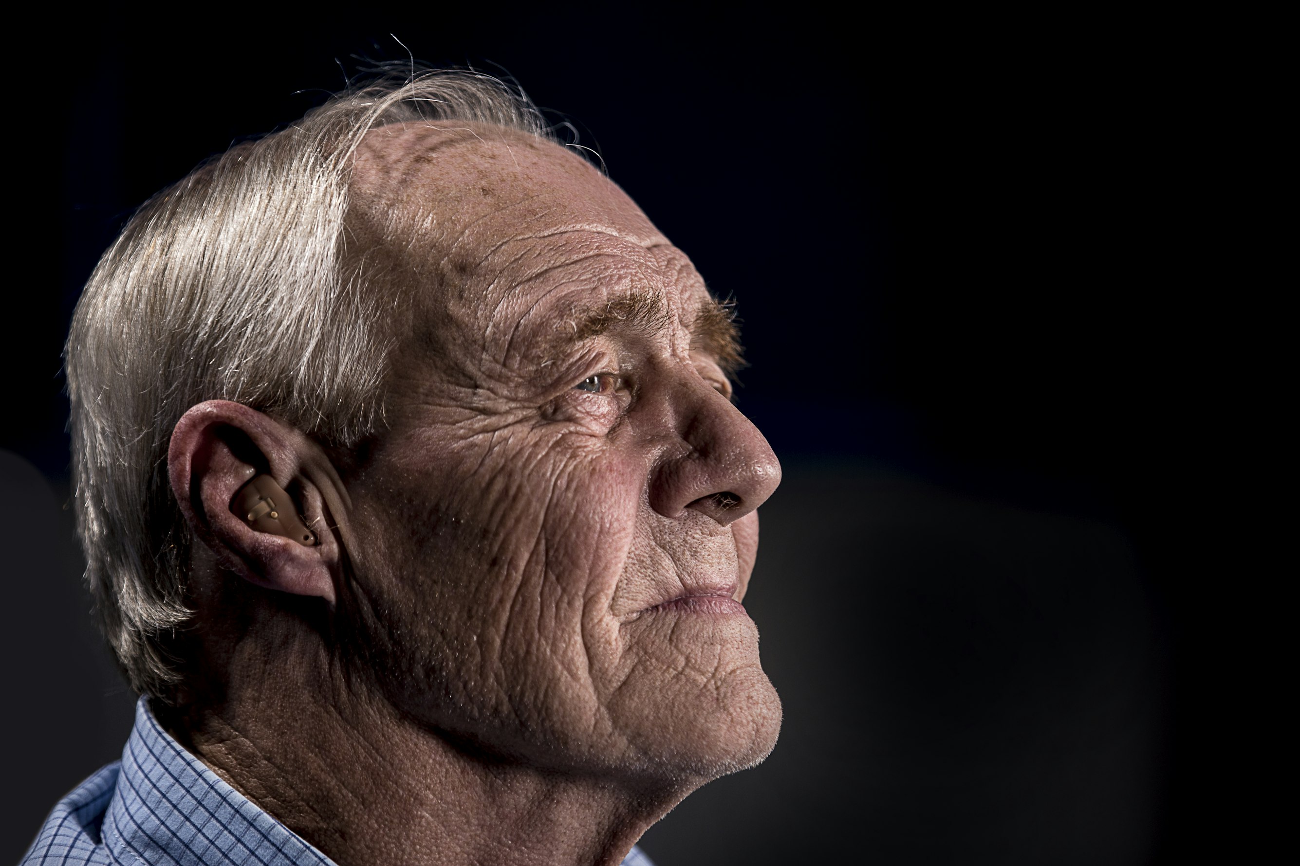 Close up of elderly man staring into the distance
