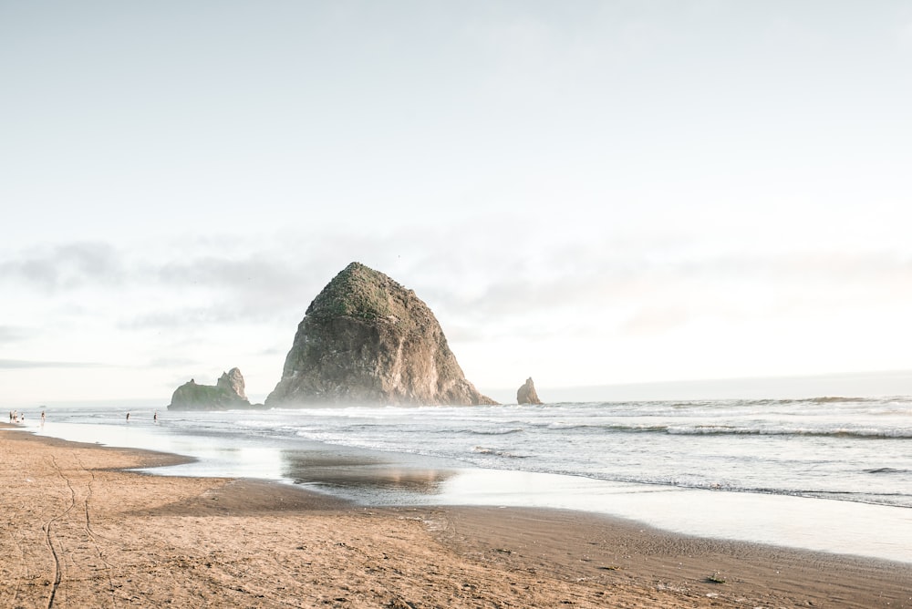 rock formation on body of water