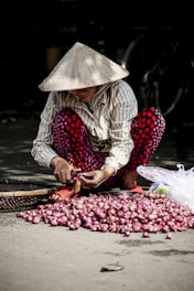 person slicing onions