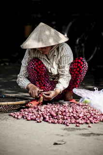 person slicing onions