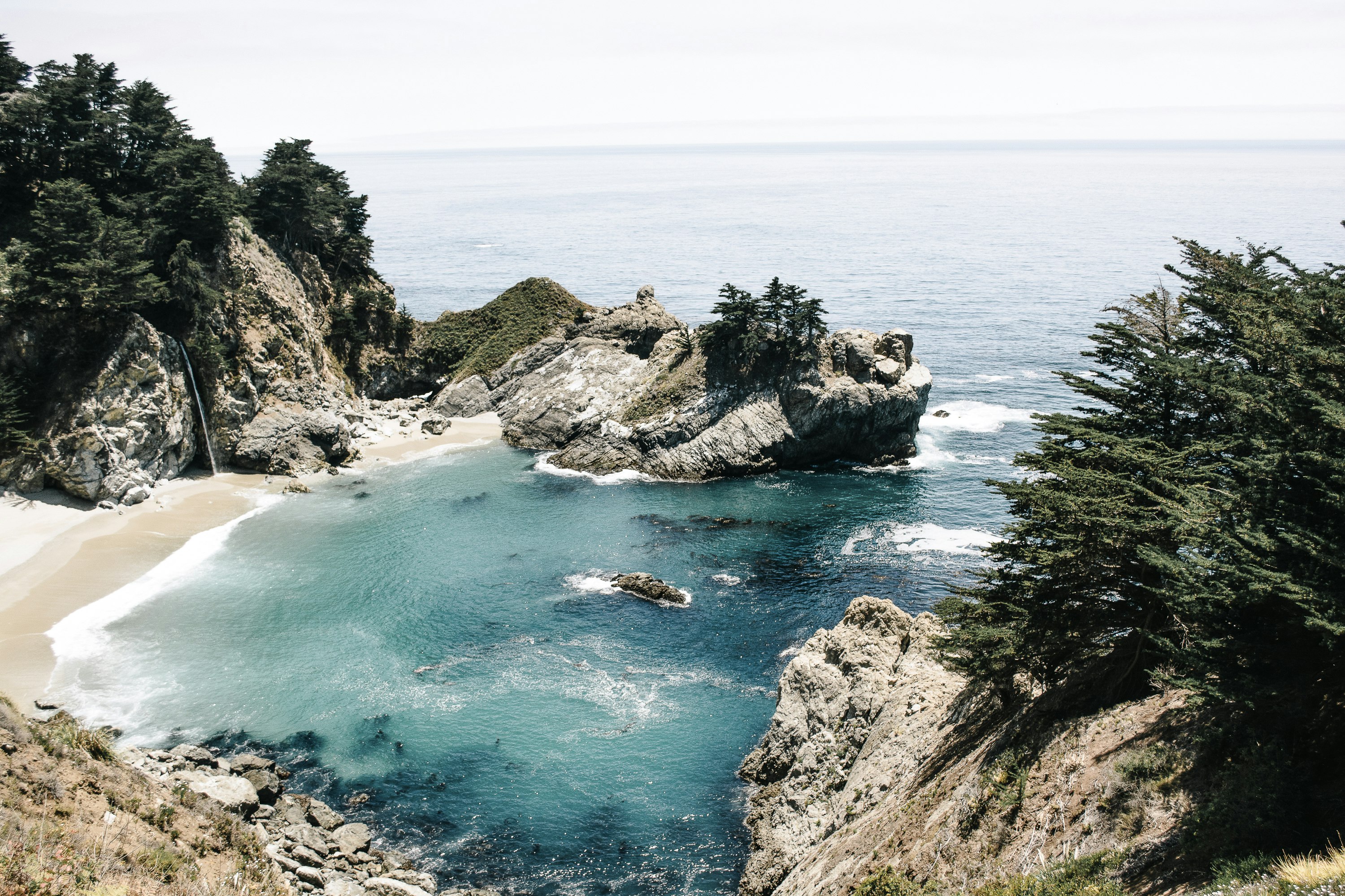 body of water and gray rock