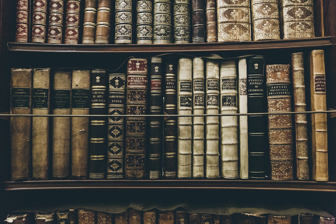books filed on bookshelf, collection of old books