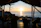 Guests enjoying a sunset from a wooden terrace overlooking the Caribbean Sea.