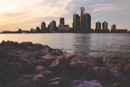 skyline photography of city buildings under blue and white cloudy skies at daytime in Windsor Canada