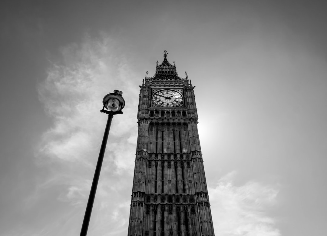 grayscale photo of clock tower