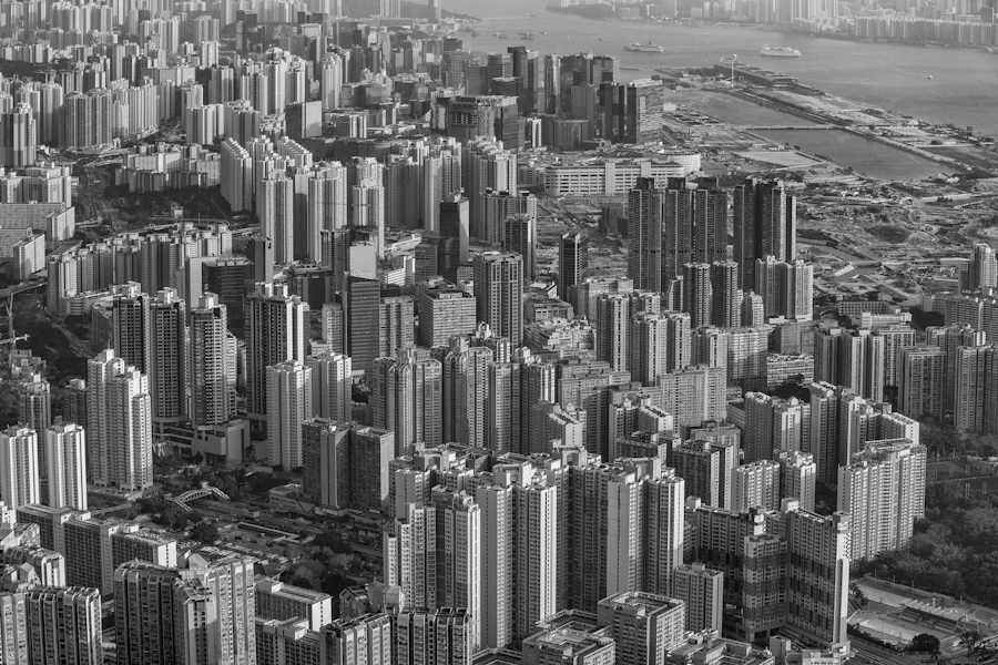 Black-and-white aerial view of tightly packed high-rise buildings in Hong Kong