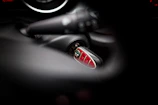 Technician programming a smart car key using specialized auto electrics equipment