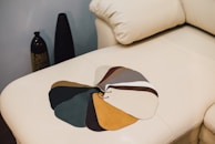 Close-up of fabric swatches in various colors and textures for furniture.