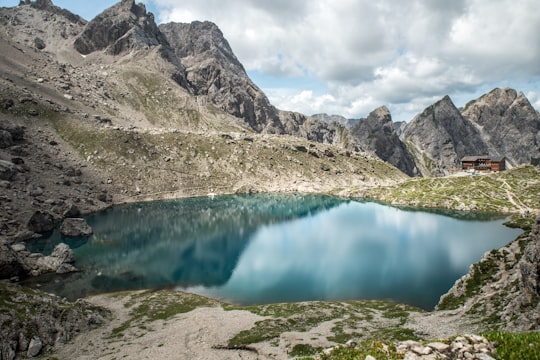 landscape photography of lake surrounded with mountains in Karlsbader Hütte Austria