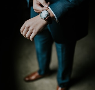 man holding his black suit