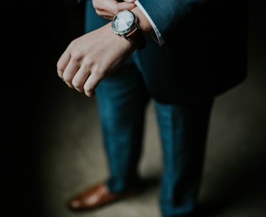 man holding his black suit