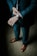 man holding his black suit