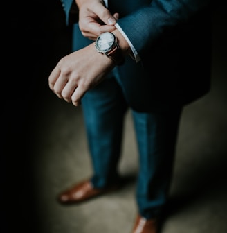 man holding his black suit