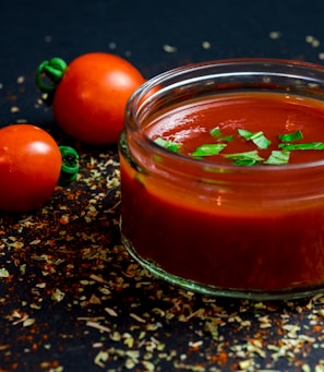 tomato and tomato puree with parsley in bowl